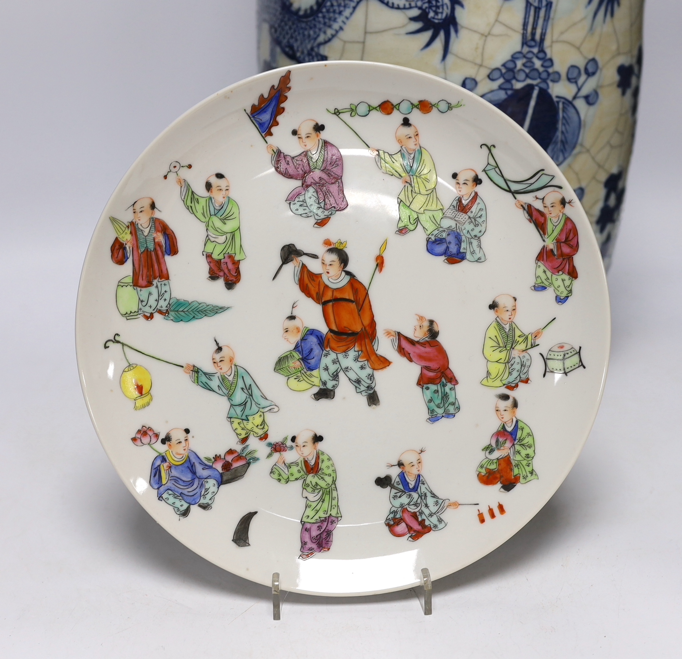 A large early 20th century Chinese blue and white crackle vase and a later plate decorated with children, 46cm high